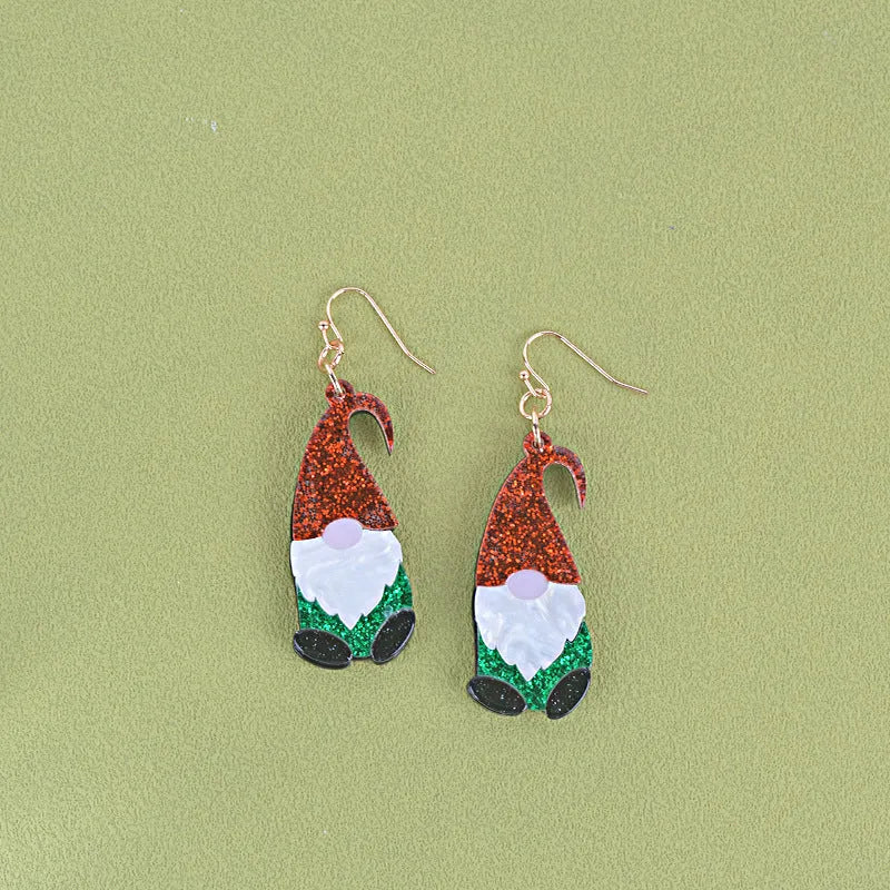 Santa Claus cartoon character acrylic fashion earrings on red, green, and mixed backgrounds.