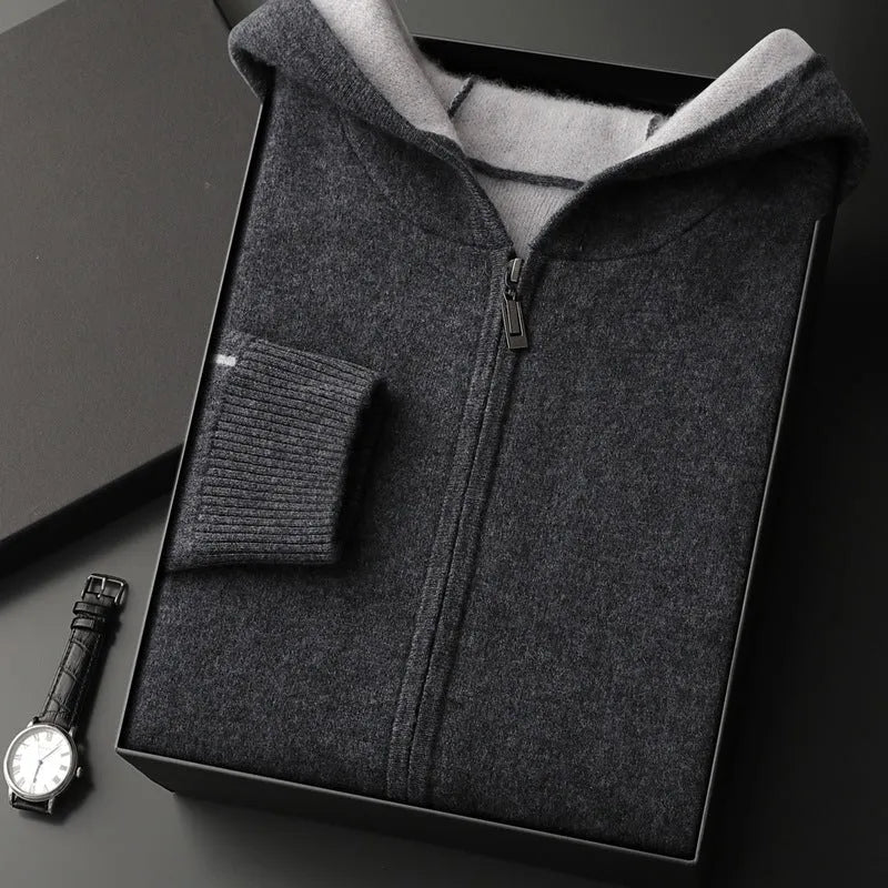 Man wearing a dark blue cashmere cardigan with a half-high collar and zippered front.