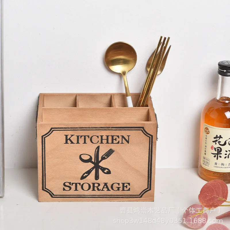 Wooden kitchen storage box with grid compartments for knives, forks, and chopsticks.