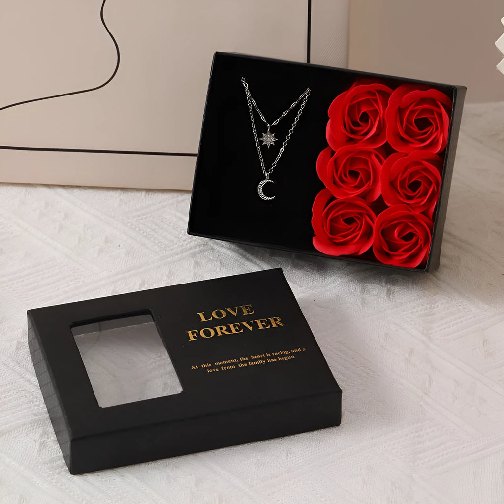 Six red soap roses in a black Korean-style gift box with a matching handbag