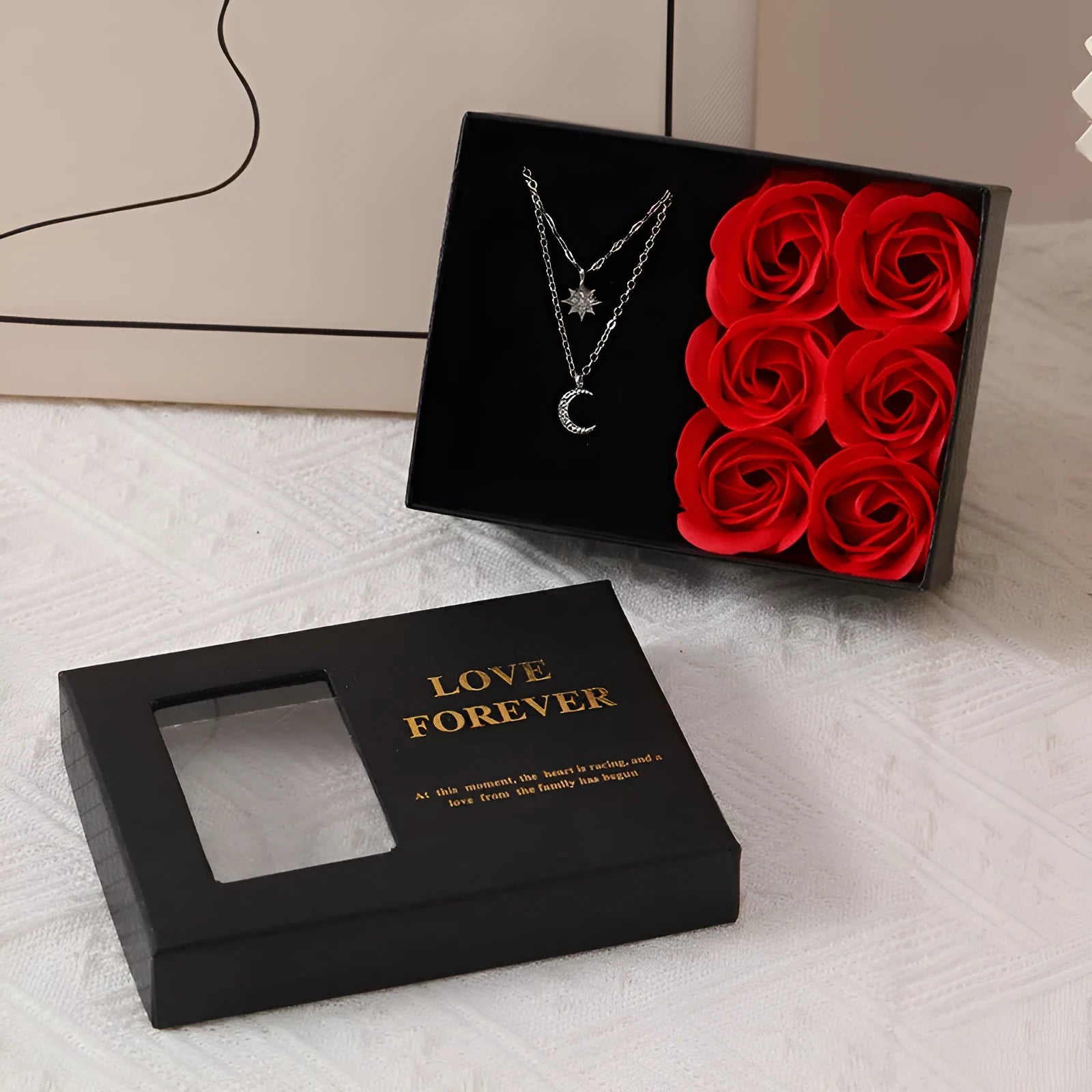 Six red soap roses in a black Korean-style gift box with a matching handbag