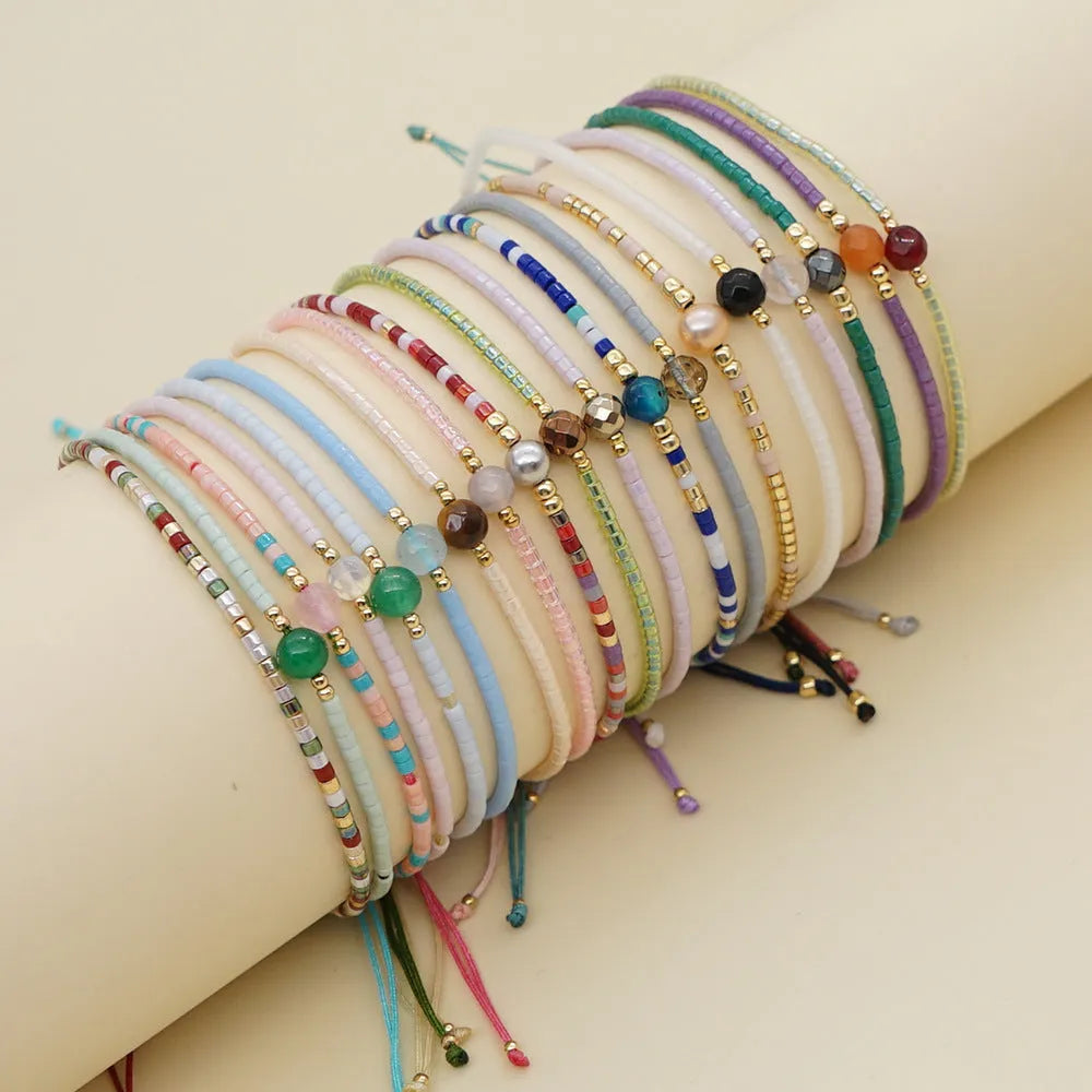 Handmade Bohemian style beaded bracelet with geometric glass and coloured glaze beads in various colours
