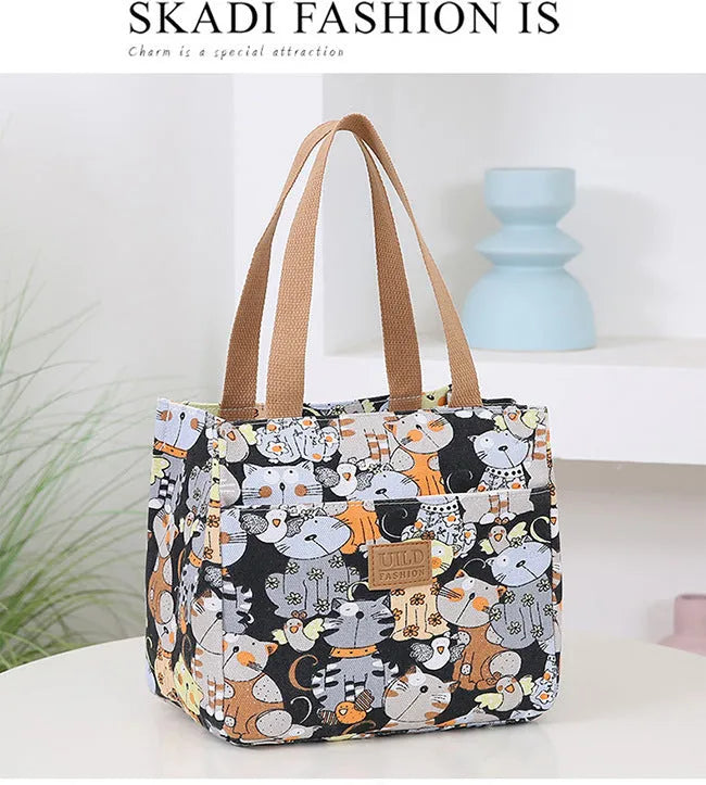 Women's large printed canvas tote bag with aluminium hardware in a horizontal square shape.