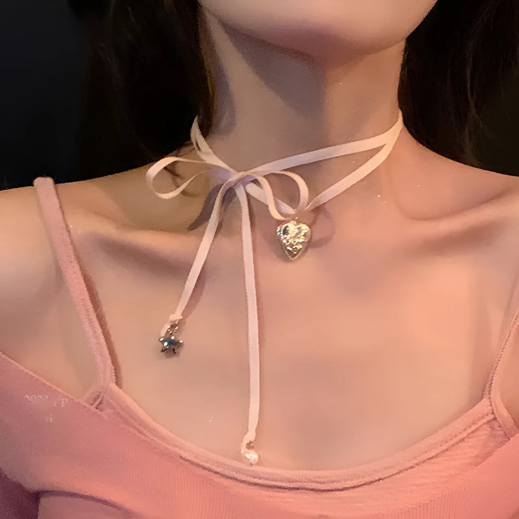 Women's silver tone ribbon love pendant necklace on clavicle length chain