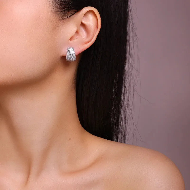 Women's geometric sterling silver ear studs with white moissanite stones