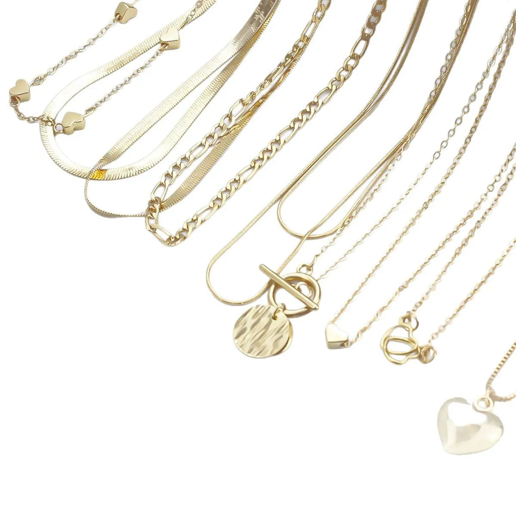 Gold tone women's necklace set with 10 ornamental pieces on snake bone chain