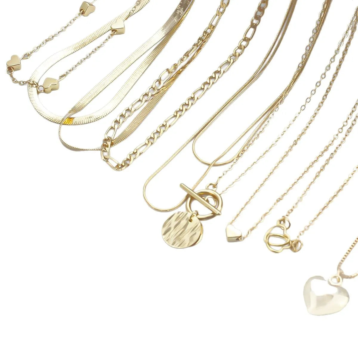 Gold tone women's necklace set with 10 ornamental pieces on snake bone chain