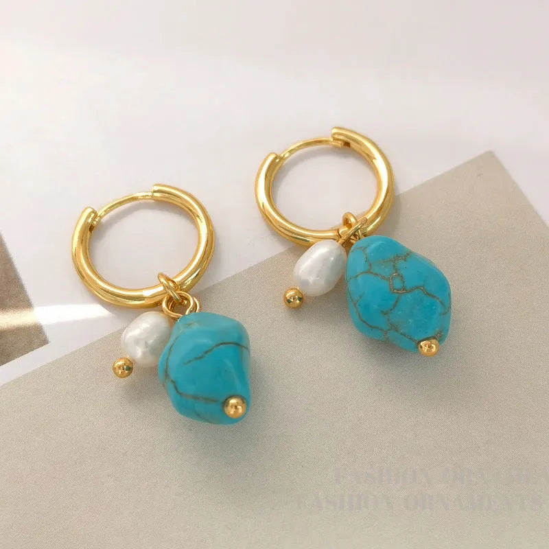 A pair of long and a pair of short geometric earrings with irregular turquoise and cultured pearls on copper ear clips.