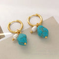 A pair of long and a pair of short geometric earrings with irregular turquoise and cultured pearls on copper ear clips.