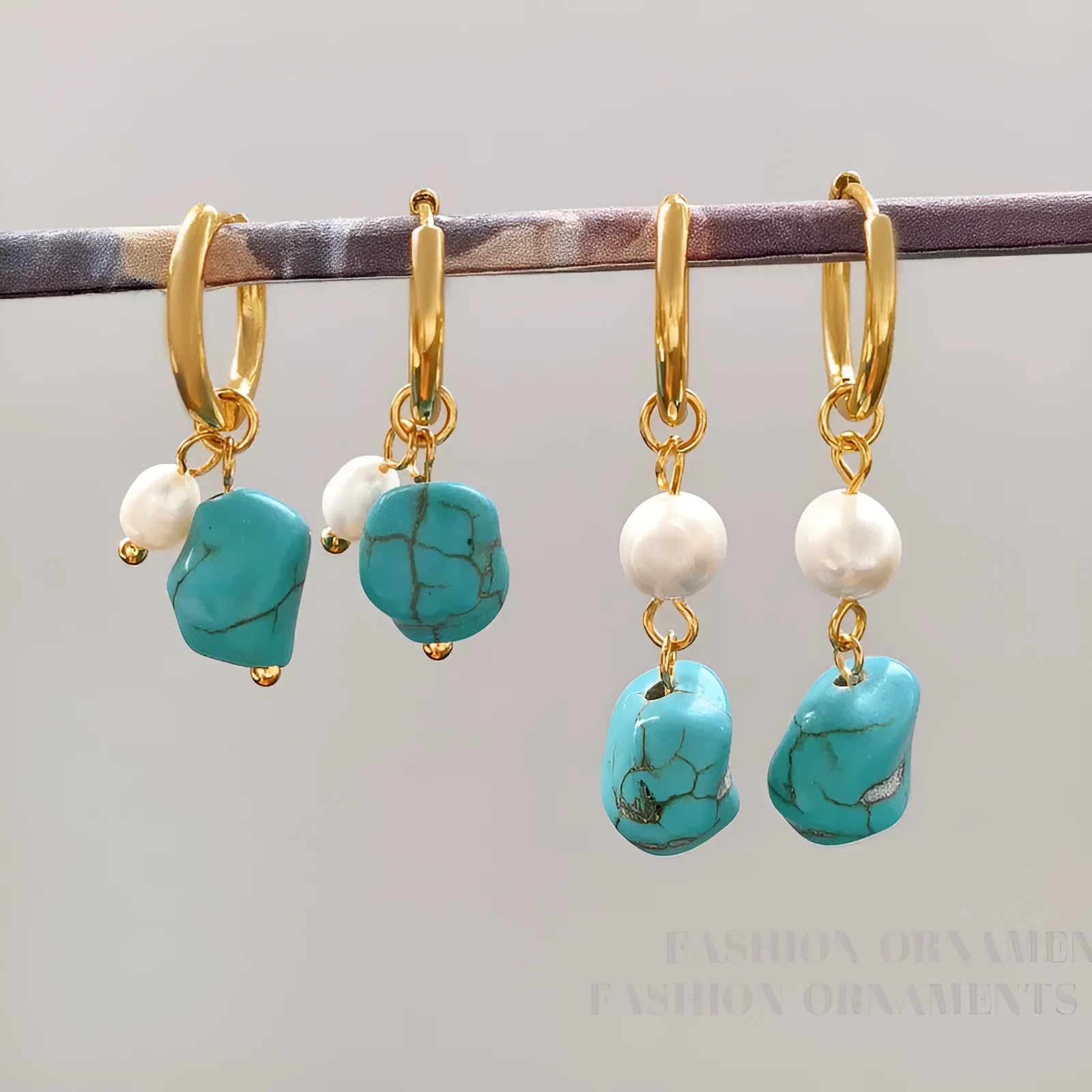 A pair of long and a pair of short geometric earrings with irregular turquoise and cultured pearls on copper ear clips.