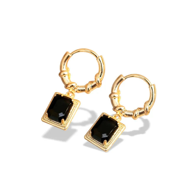 Close-up of women's black zircon geometric earrings made from solid copper with a quadrilateral design.
