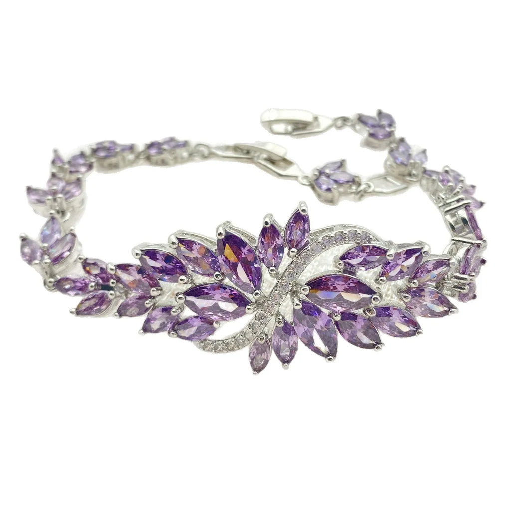Gold-plated copper bracelet with coloured zircon stones in an ice flower design.