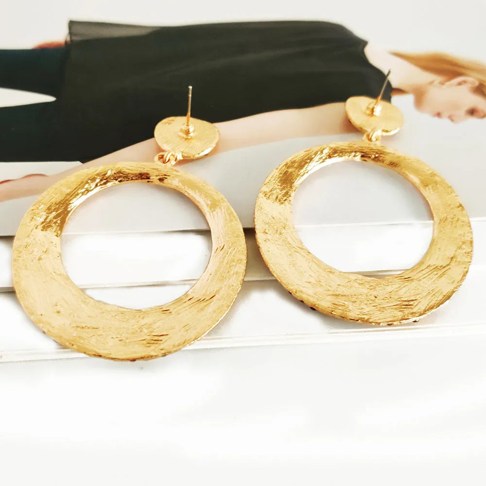 Coloured cartoon-style alloy earrings with a large round pendant and diamond design.