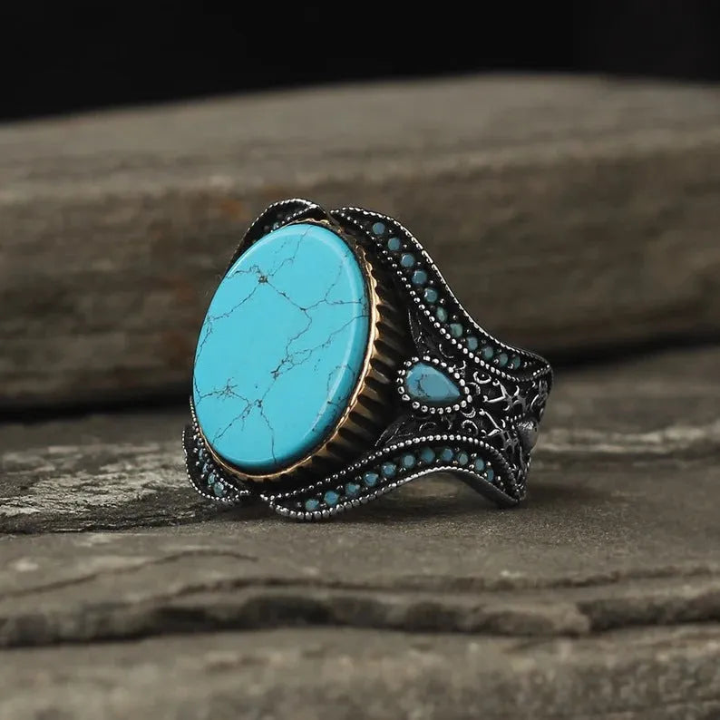Men's turquoise antique silver alloy ring showing round band with simple design