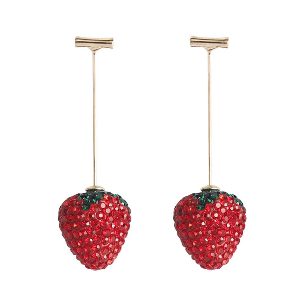 Close-up of women's geometric strawberry-shaped earrings with spot drill texture, on a red background.