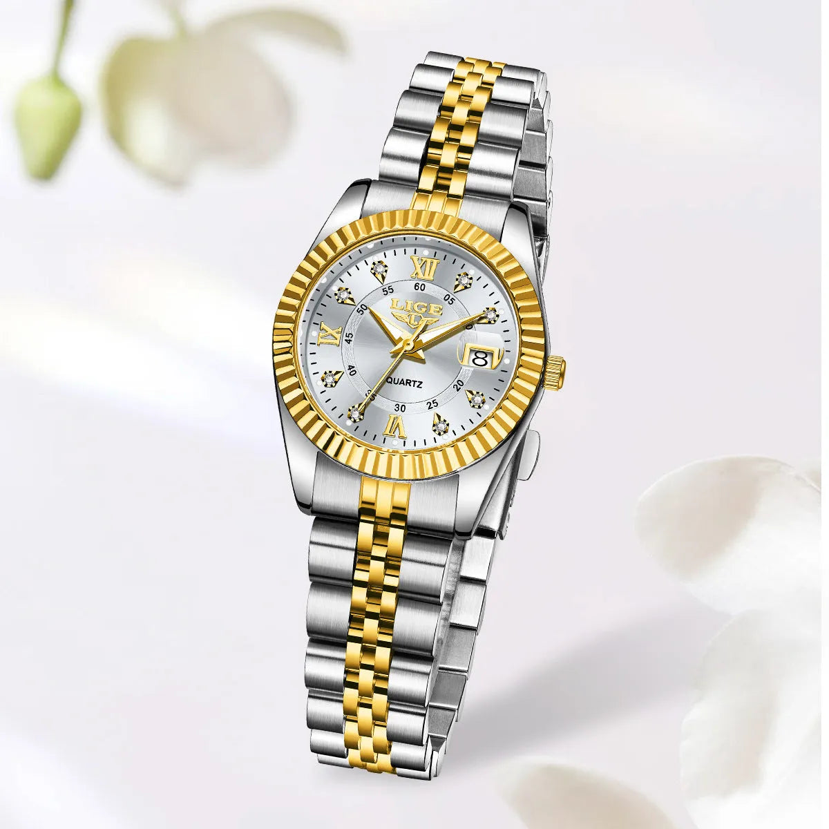 Slim gold and silver ladies quartz fashion watch with multiple dial colour options on a wrist.