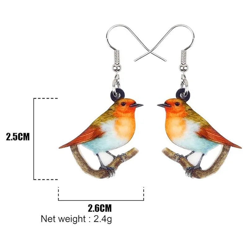 Geometric Blue Tit bird acrylic drop earrings with surgical steel posts on a white background.