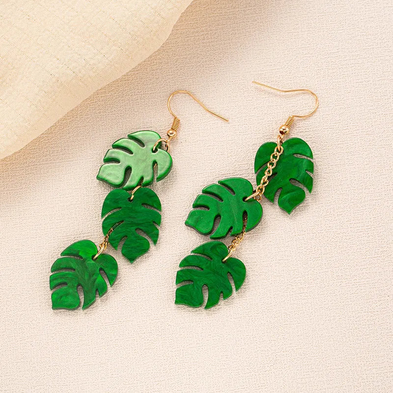 Women's drop earrings with a colourful acrylic coconut jackfruit charm on a metal hook.