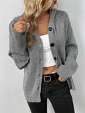 A solid colour loose-fit hooded cardigan sweater made from thick cotton fabric.