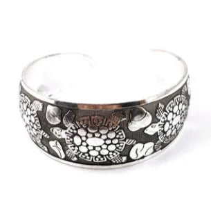 Ethnic carved open Miao silver bracelet with Roman patterns showing elephant and turtle motifs