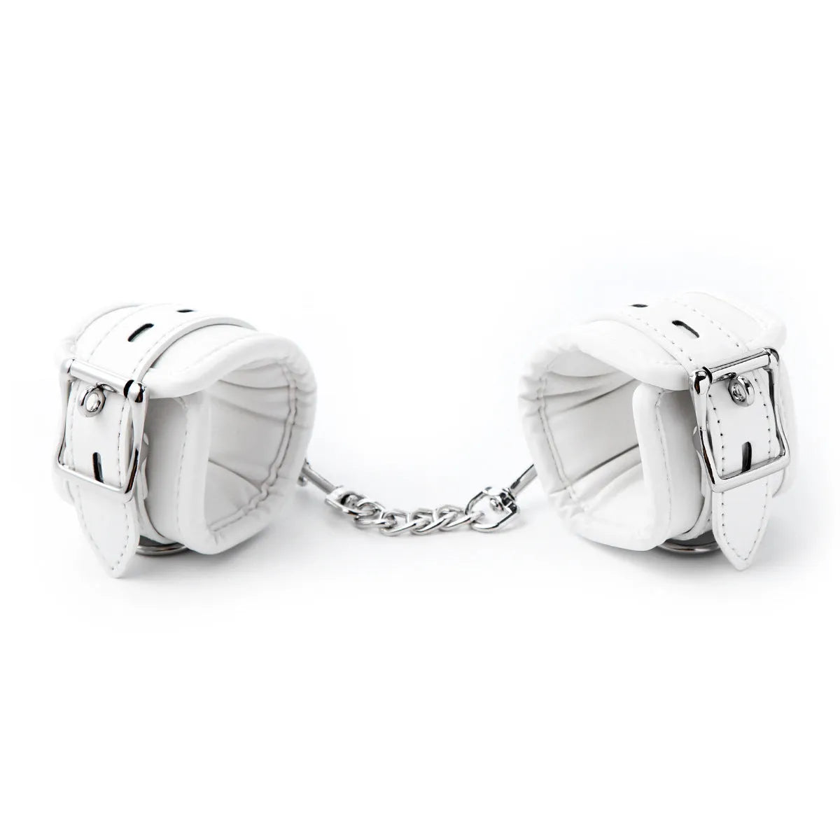 White PU sponge bondage set showing handcuffs, footcuffs, and a neck cuff laid out on a dark surface.