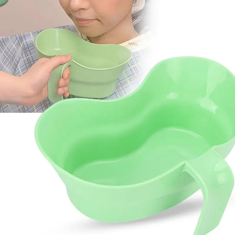 Green plastic nursing care gargle cup for bedridden patient oral hygiene.