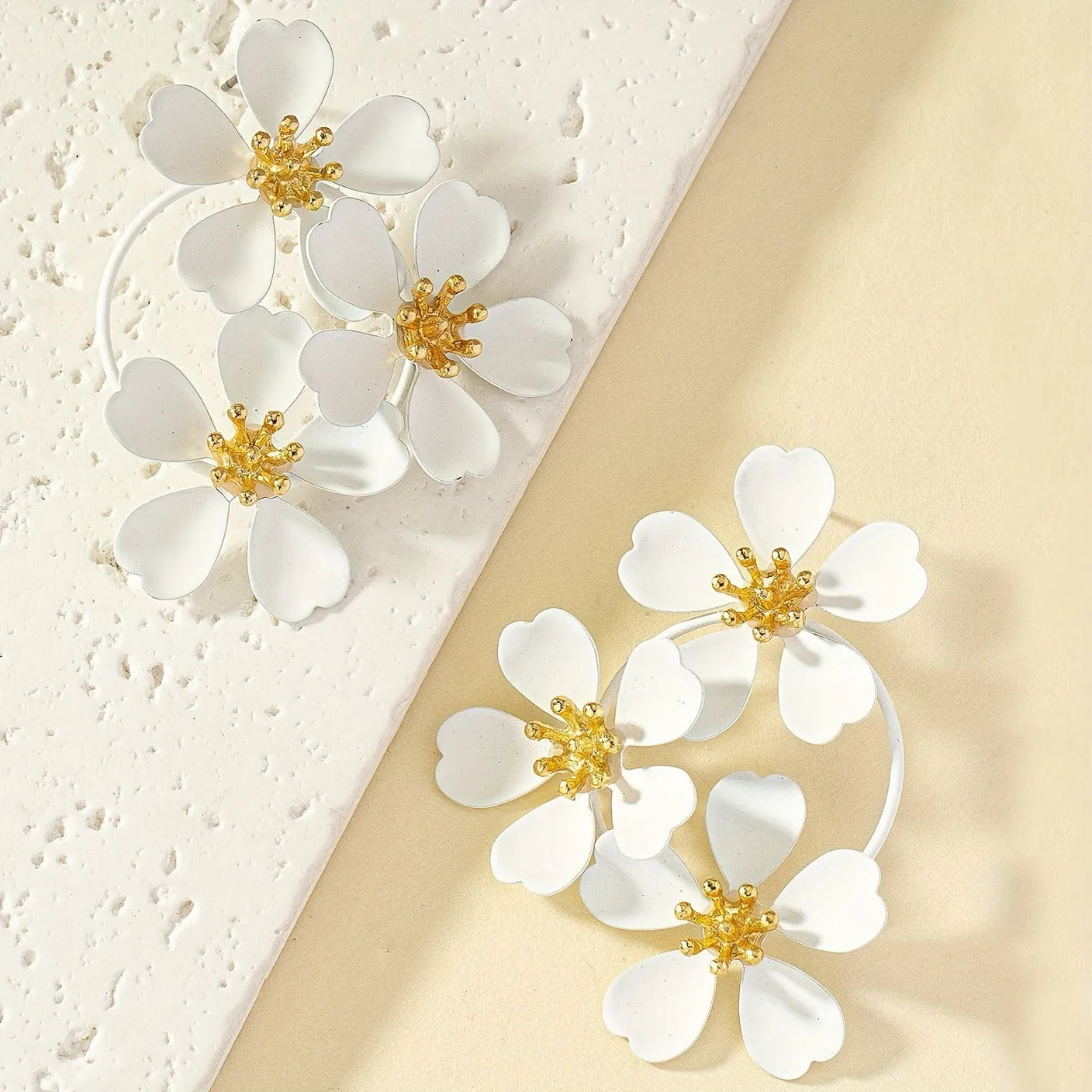 Retro flower-shaped clip-on earrings in black and white colour options
