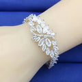 Gold-plated copper bracelet with coloured zircon stones in an ice flower design.