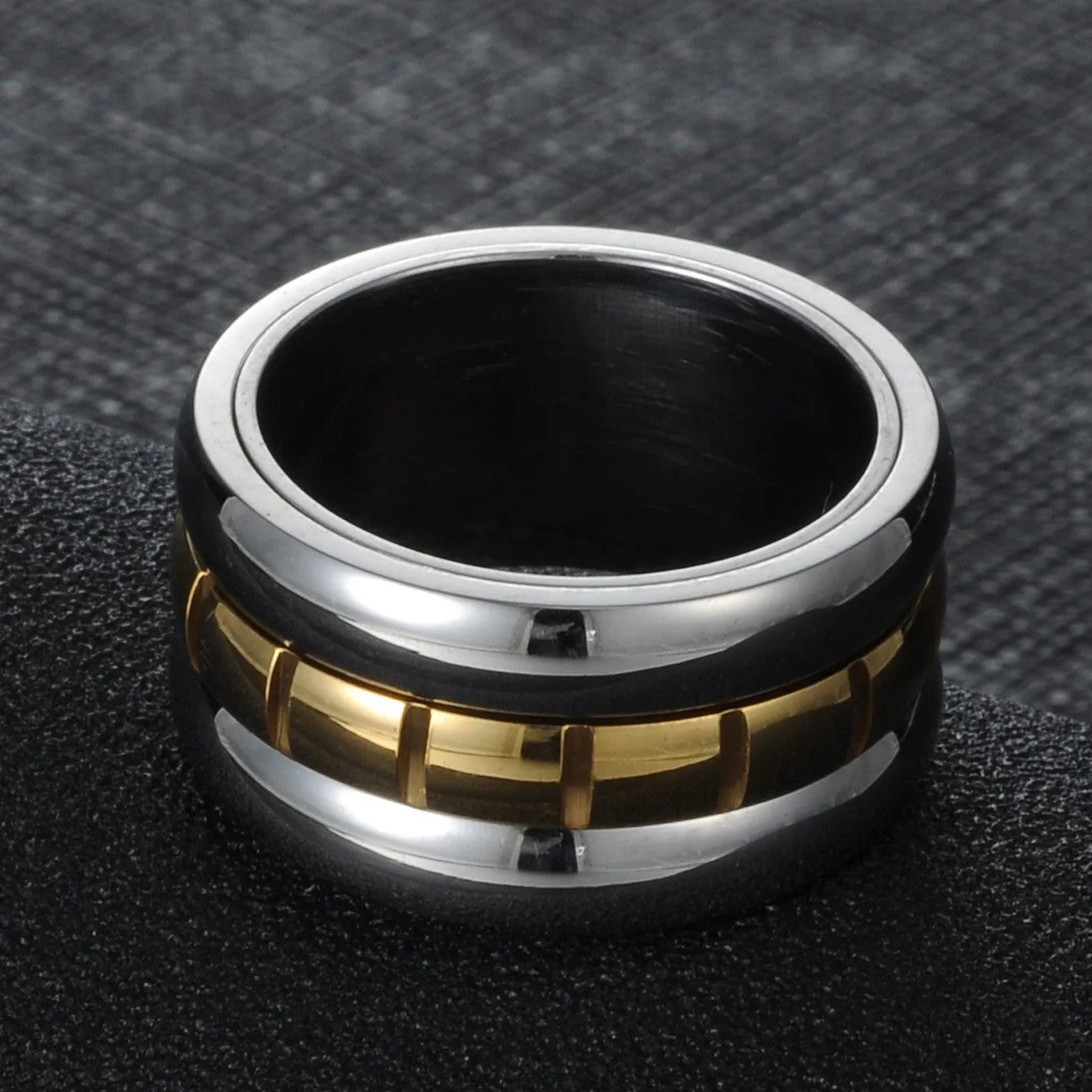 Gold titanium steel ultra-wide knuckle ring with a rotatable tail on a hand