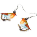 Geometric Blue Tit bird acrylic drop earrings with surgical steel posts on a white background.