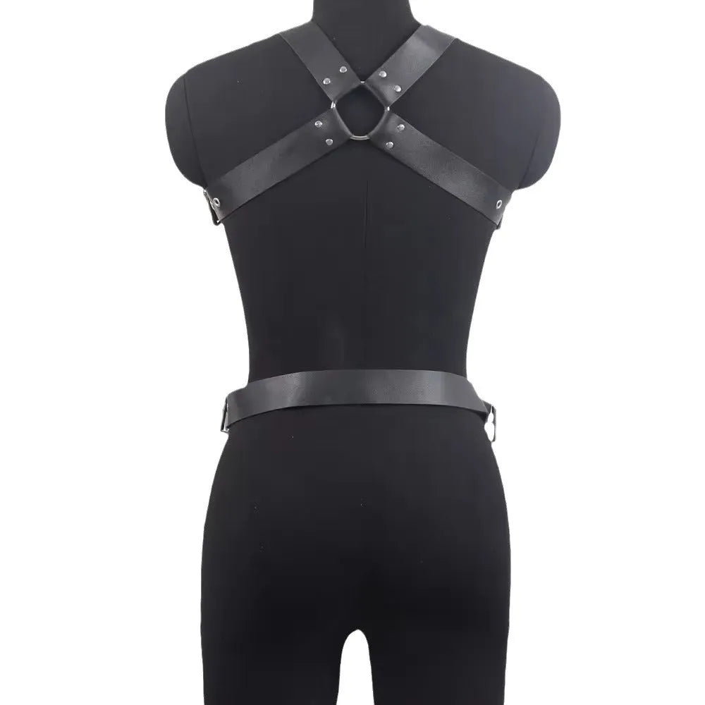Black patent leather thin waist-cinching belt with a pin buckle on a mannequin.