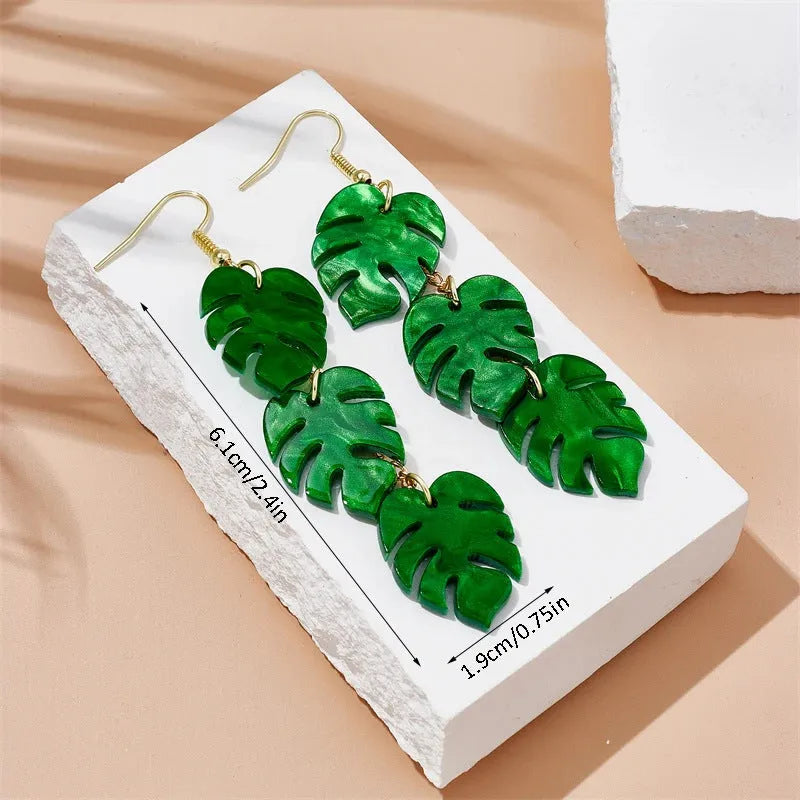 Women's drop earrings with a colourful acrylic coconut jackfruit charm on a metal hook.