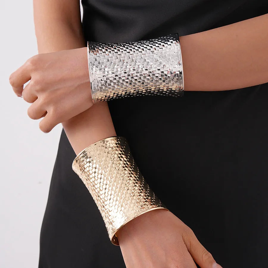 Women's vintage metal bracelet with exaggerated round design in gold colour.