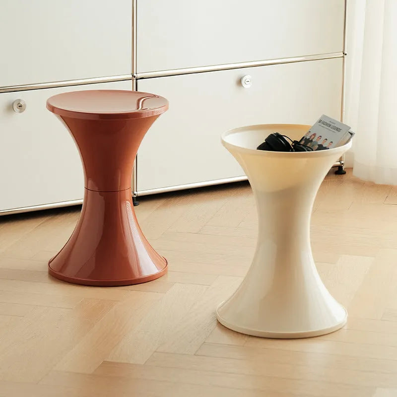 A plastic hourglass-shaped shoe changing stool in a choice of five colours.