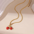 Strawberry fruit charm necklace in red or white gradient on a silver-toned chain.
