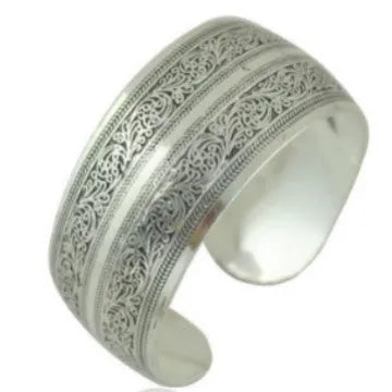 Ethnic carved open Miao silver bracelet with Roman patterns showing elephant and turtle motifs