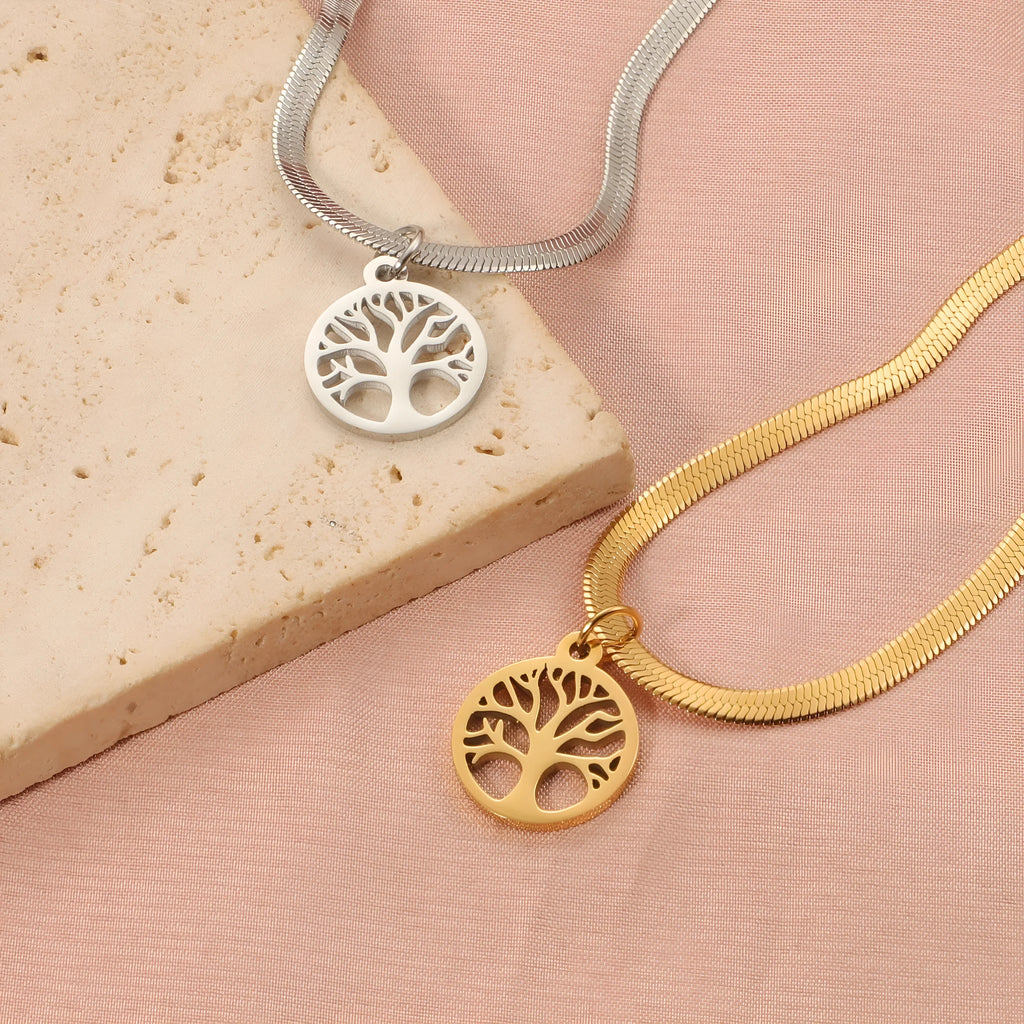 Stainless steel adjustable lucky tree necklace with a snake bone chain on a white background.