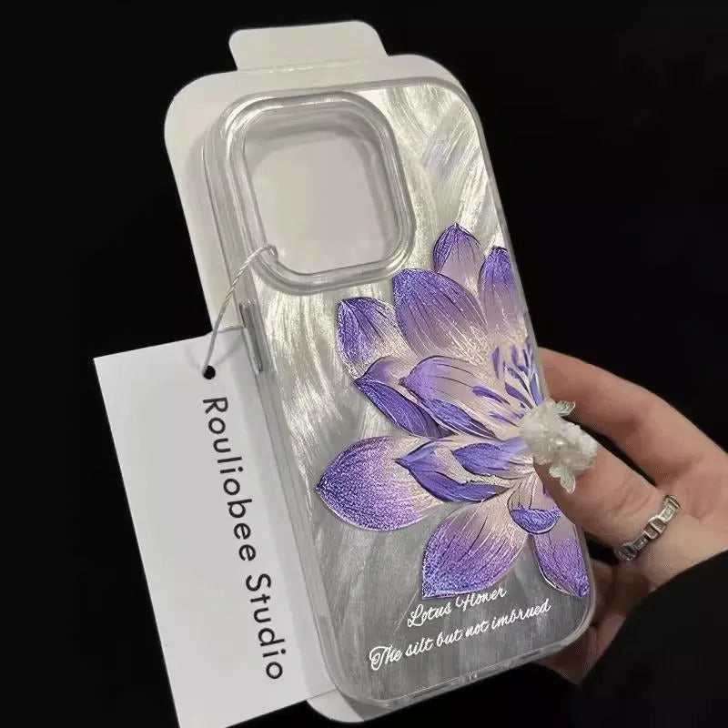 Hard polycarbonate iPhone case with blue lotus floral IMD pattern showing screen and camera cut-outs