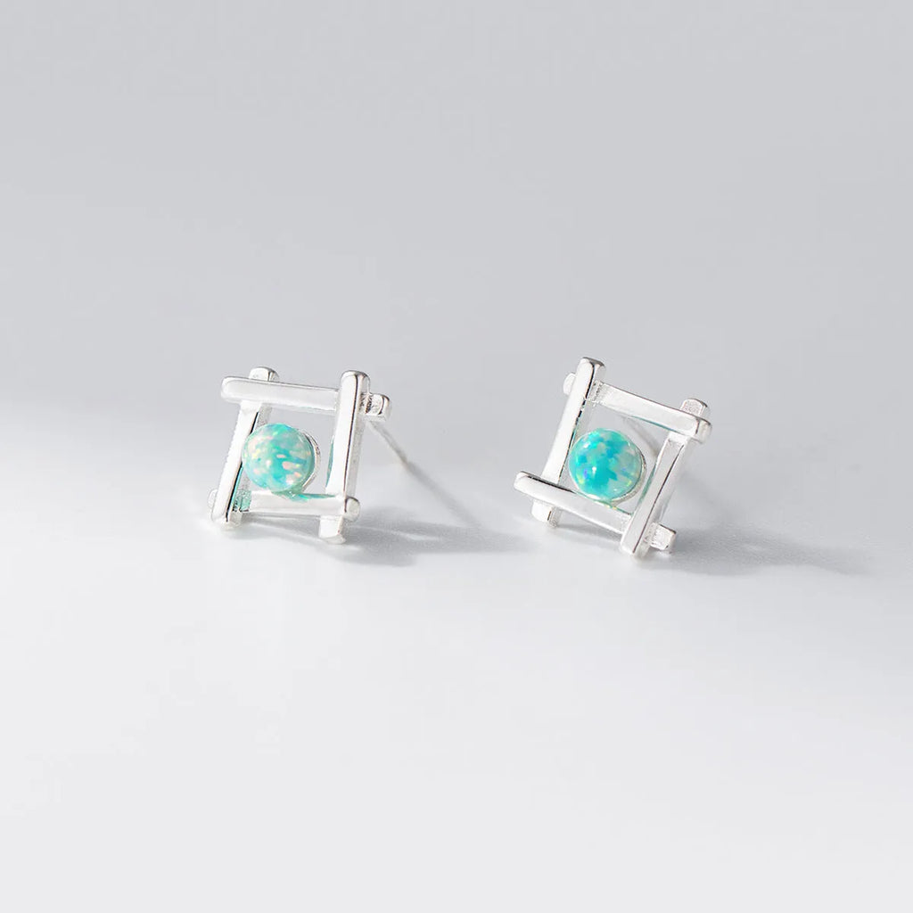 Geometric cross-shaped 925 silver stud earrings in gold and silver tone options.