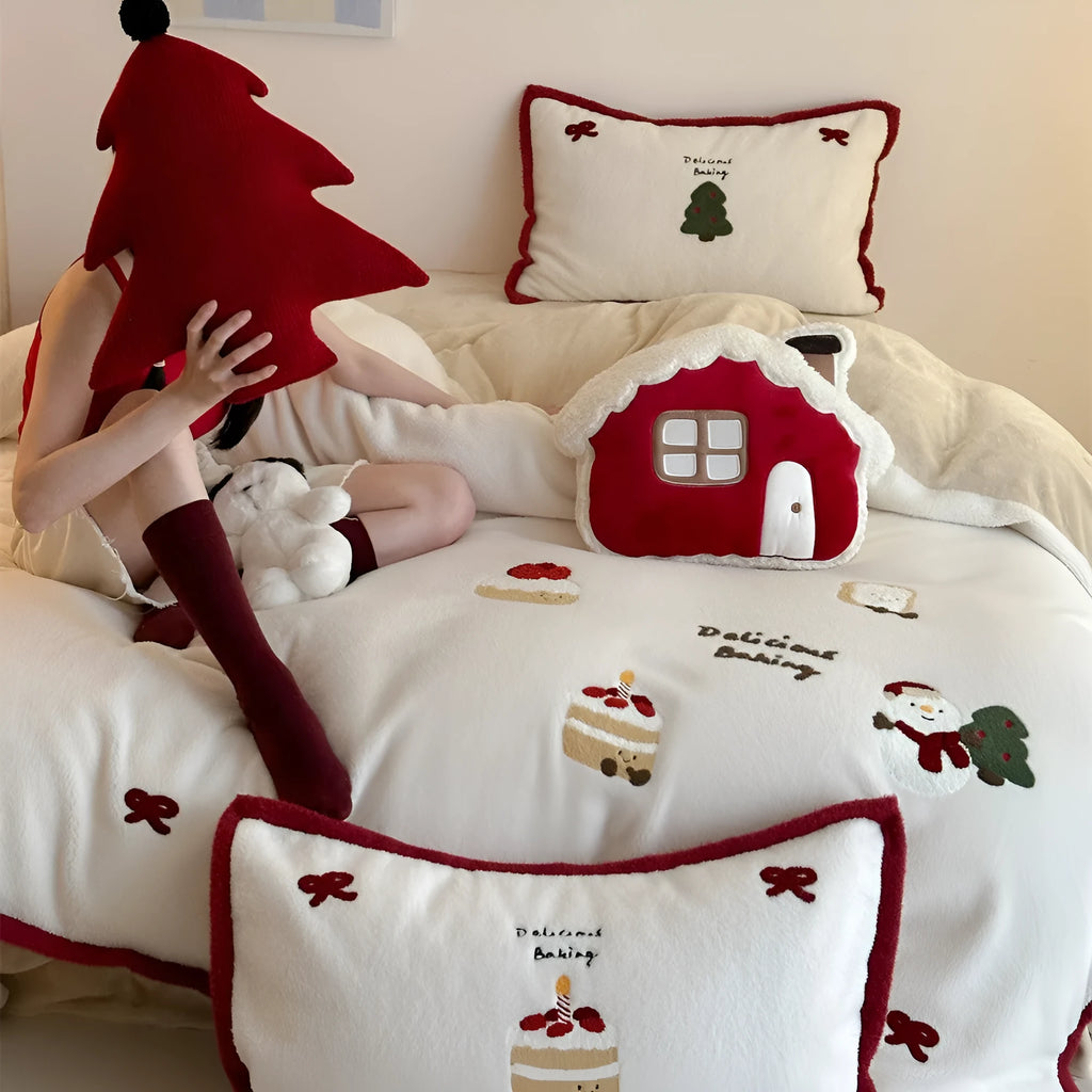 Winter Christmas cartoon bedding four-piece set with snowman milk pastry pattern on bed