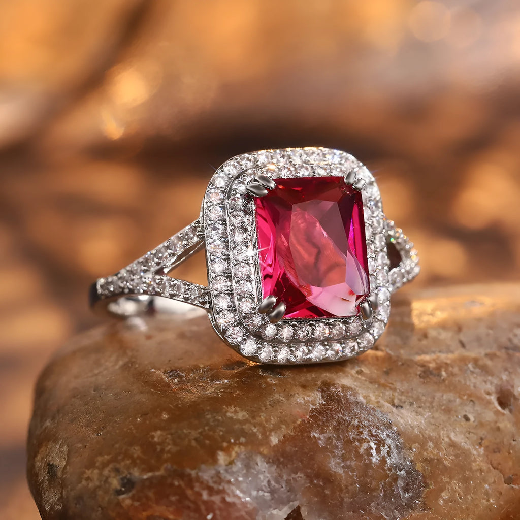 Women's copper square ring with red rhinestones, shown in a geometric princess cut design.