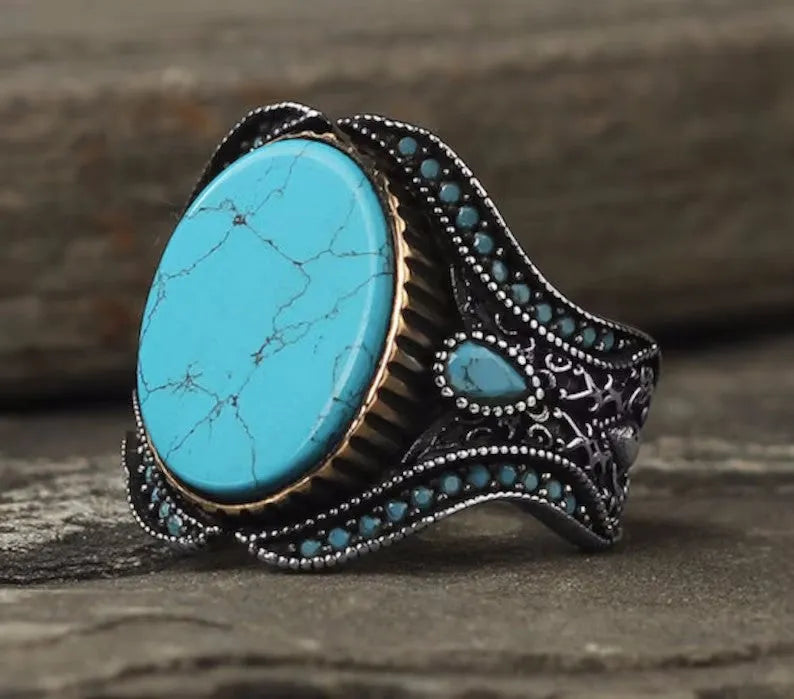 Men's turquoise antique silver alloy ring showing round band with simple design