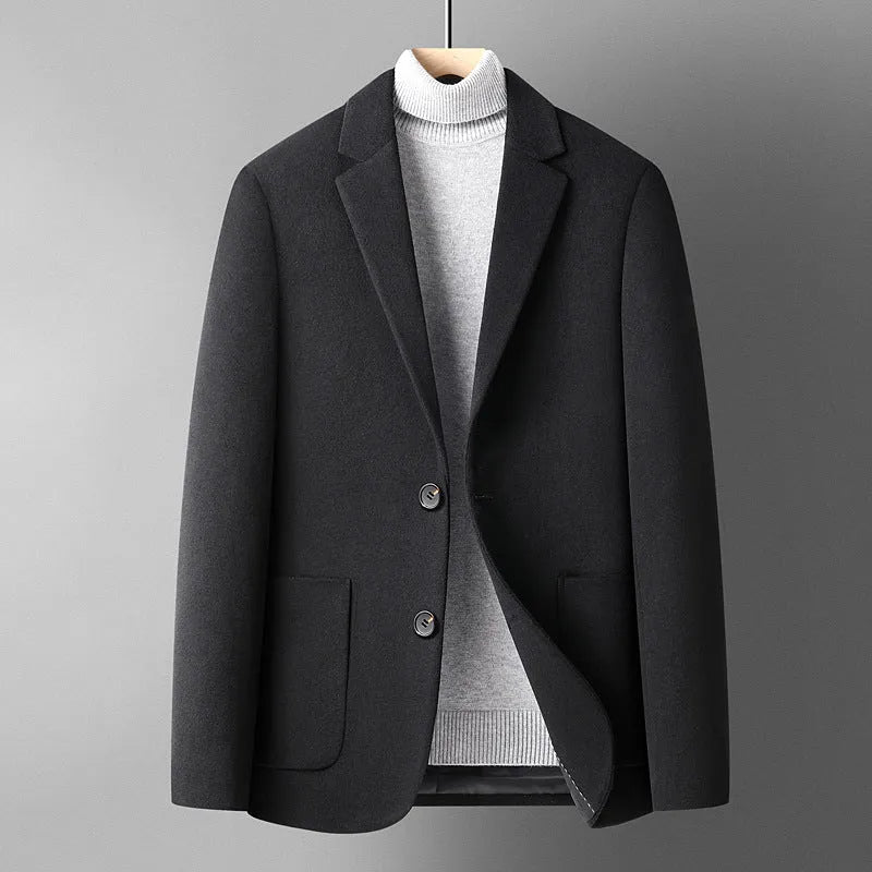 Men's slim fit wool suit jacket in grey on a hanger.