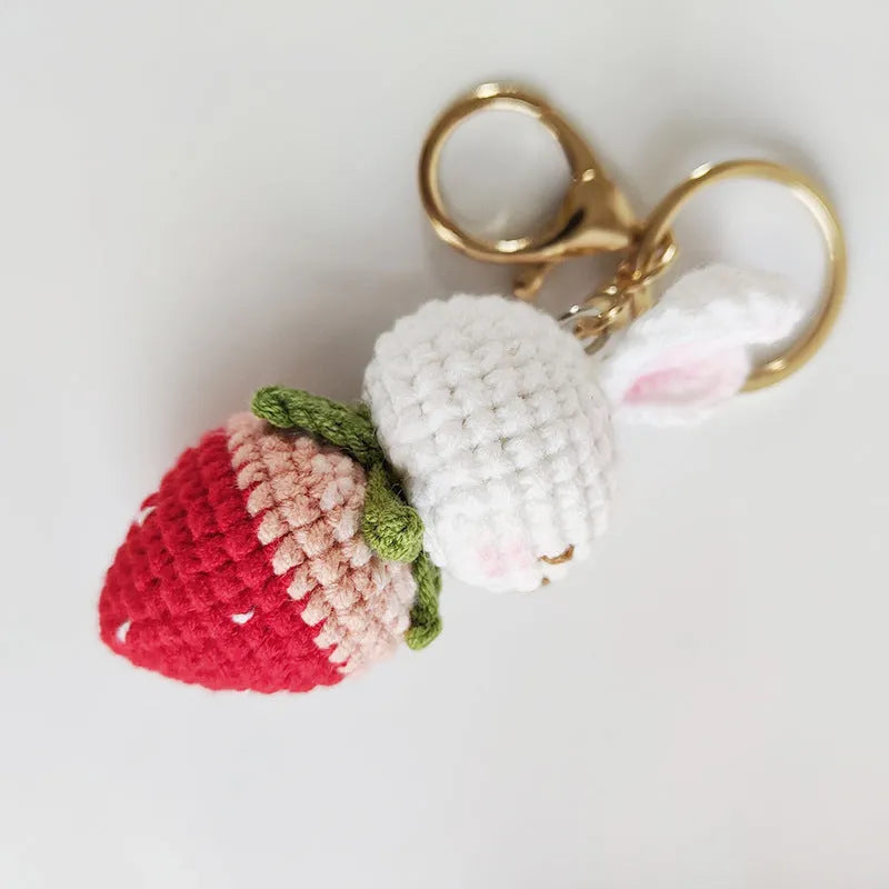 Hand-woven white rabbit strawberry pendant charm made from colourful doll wire on a keyring.
