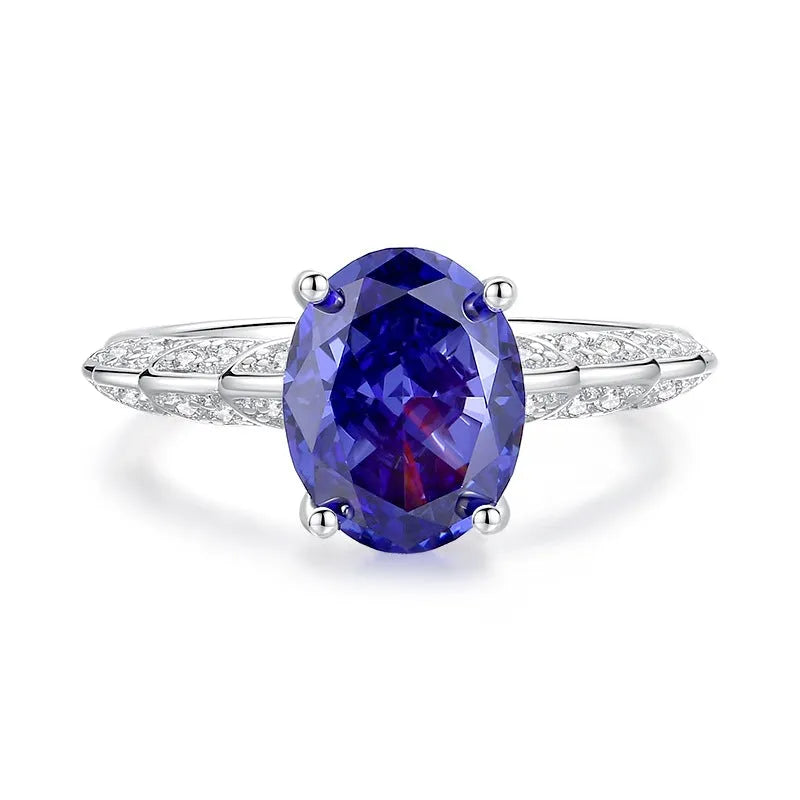 Heart-shaped sterling silver ring with a sparkling diamond-cut colour zircon stone.