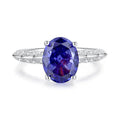 Heart-shaped sterling silver ring with a sparkling diamond-cut colour zircon stone.