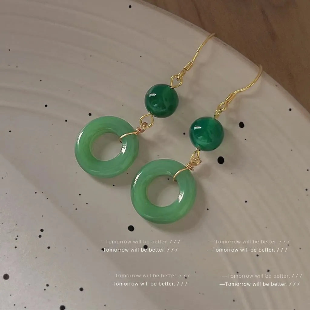 Green and gold Chinese style earrings with cheongsam peace buckle design in geometric shape
