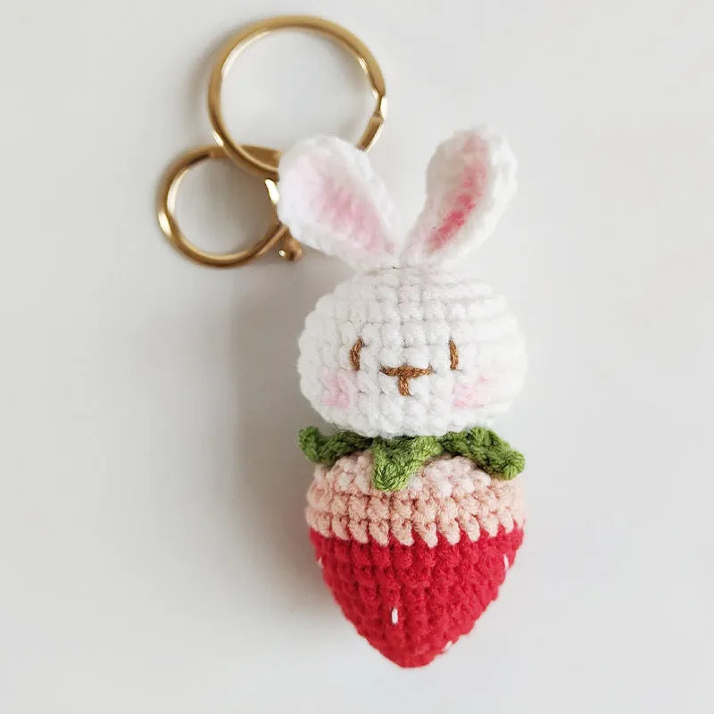 Hand-woven white rabbit strawberry pendant charm made from colourful doll wire on a keyring.