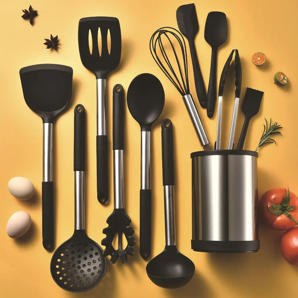 12-piece black silicone kitchen utensil set with tools stored in a rotating countertop storage bucket