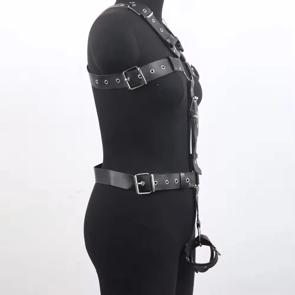 Black patent leather thin waist-cinching belt with a pin buckle on a mannequin.